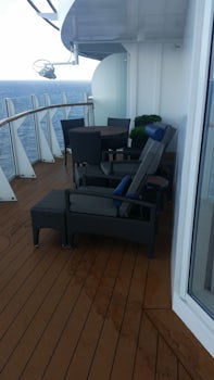 Sitting area of the balcony.  There are two sliding doors, one from the liv