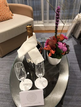 Welcoming champagne and flower arrangement