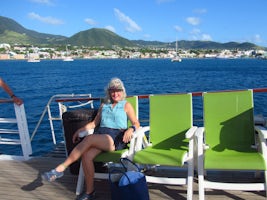 Relaxing on deck with St.kitts in the distance.