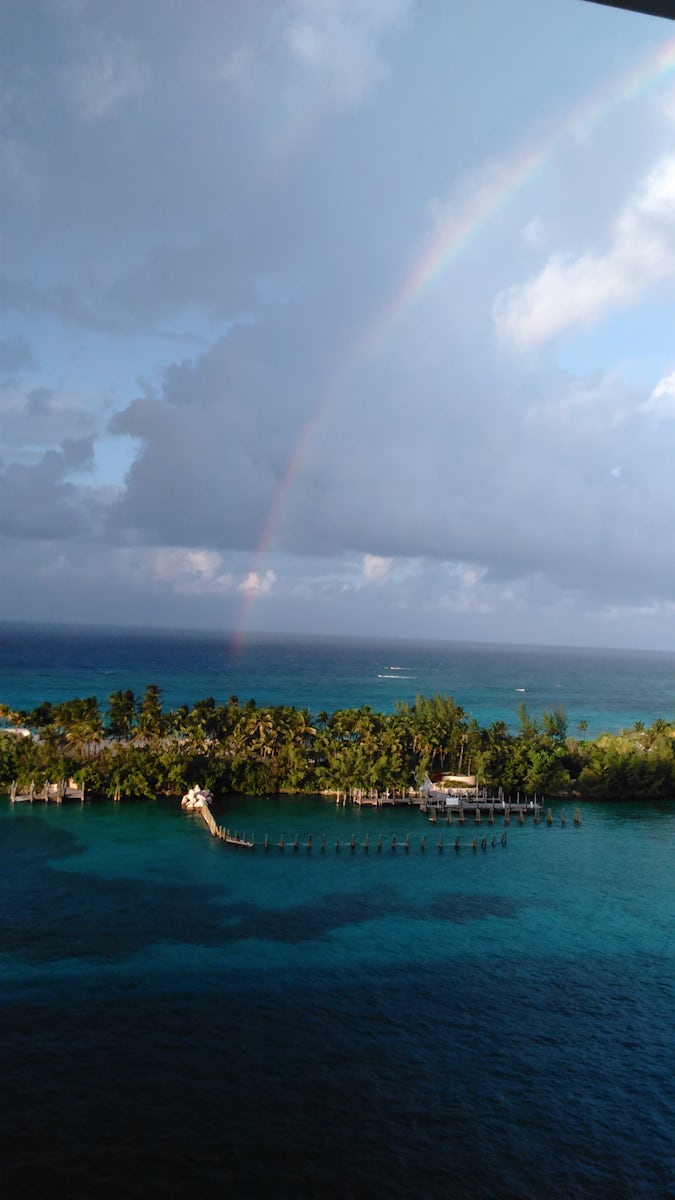 In Port in Nassau. This rainbow as viewed from our deck 14 balcony about sums up our cruise.