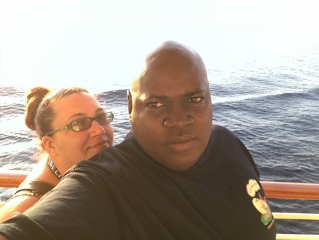Me and my fiancé on a small ship heading back to the cruise ship