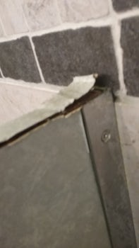 More crumbling in another bathroom on ship.