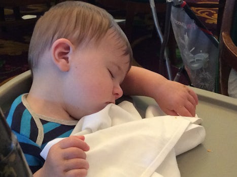 My 9 month grandson sleeping at late dinner.