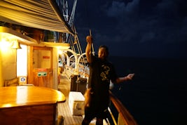 The chef fishing from the ship while docked. He let me pull one up!