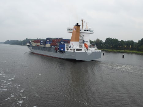 Cargo ship passing cruise ship in Kiel Canal