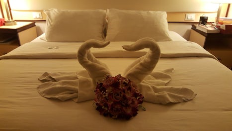 Cabin steward made towel swans left during our vow renewal ceremony