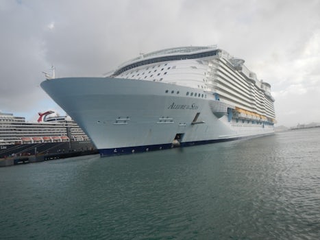 Allure of the Seas, docked next to two other cruise ships.
