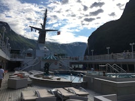 Departure up Fjord with close shoreline both sides, Crystal Symphony, Geira