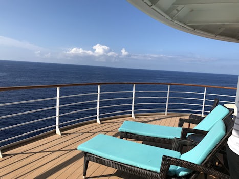 Anchored at sea of the coast at Kona.  Suite guests get priority tender to