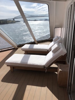 Veranda with glass panels to help block the wind while sailing.