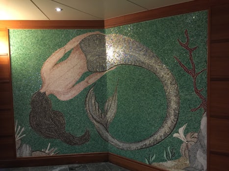 Mermaid mosaic in the indoor pool area.