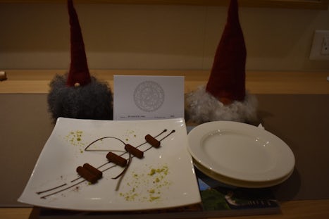 Gnomes adopted from the gift shop, eying the special dessert that the dinin