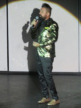 Cruise director in jazzy clothes and sparle shoes