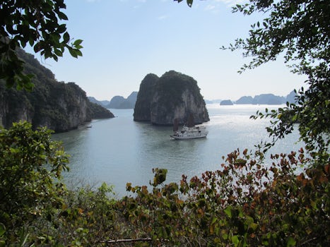 Asian Junk Boat touring in Halong Bay, Vietnam.  This picture was taken from the Caves showing the rock formations that make up 3,000 peaks.