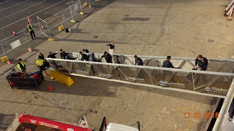 Human chain disembarking the luggage