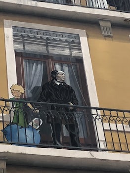 Faux painting on a building; St Exupery and Le Petit Prince,