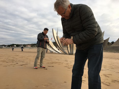 The time spent at Omaha Beach was amazing...one of our favorite shore excursions. In this picture, my husband and son-in-law gather sand from the beach. We purchased small glass containers, containing the beach name, before arriving at the beach. An inexpensive yet beautiful souvenir.