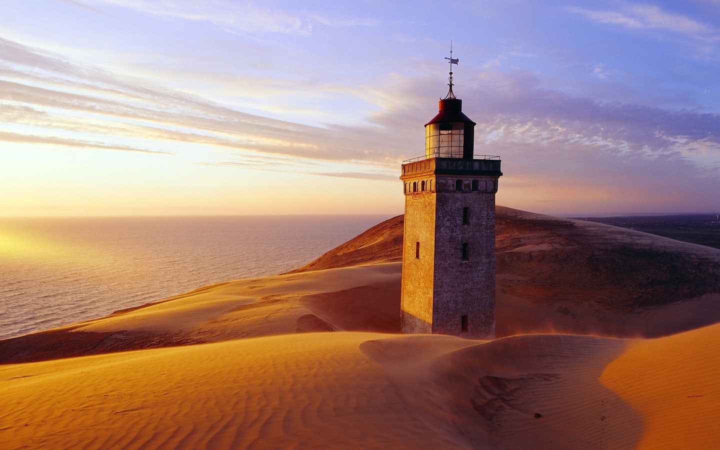 Welcome to Denmark .. 
NorthSea Lighthouse in it’s finial years being encouraged by sand and sea.