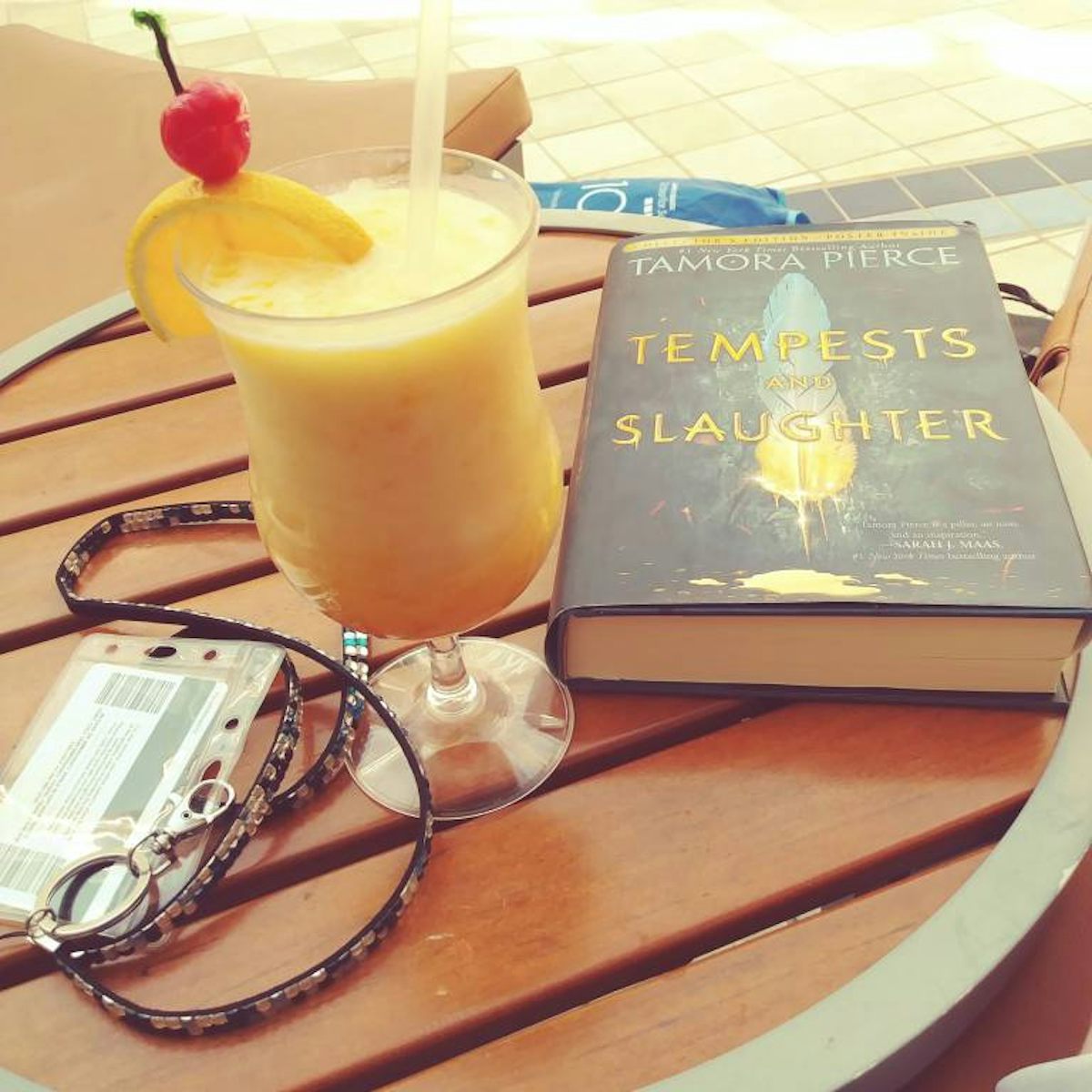 Cocoloco and book by the pool