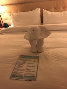 This is the king size bed with a cute elephant towel animal.