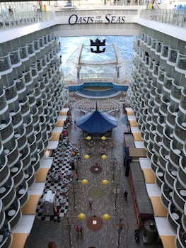 Looking down from Deck 15 at the Boardwalk area and Aqua Theater on Deck 6 on Oasis