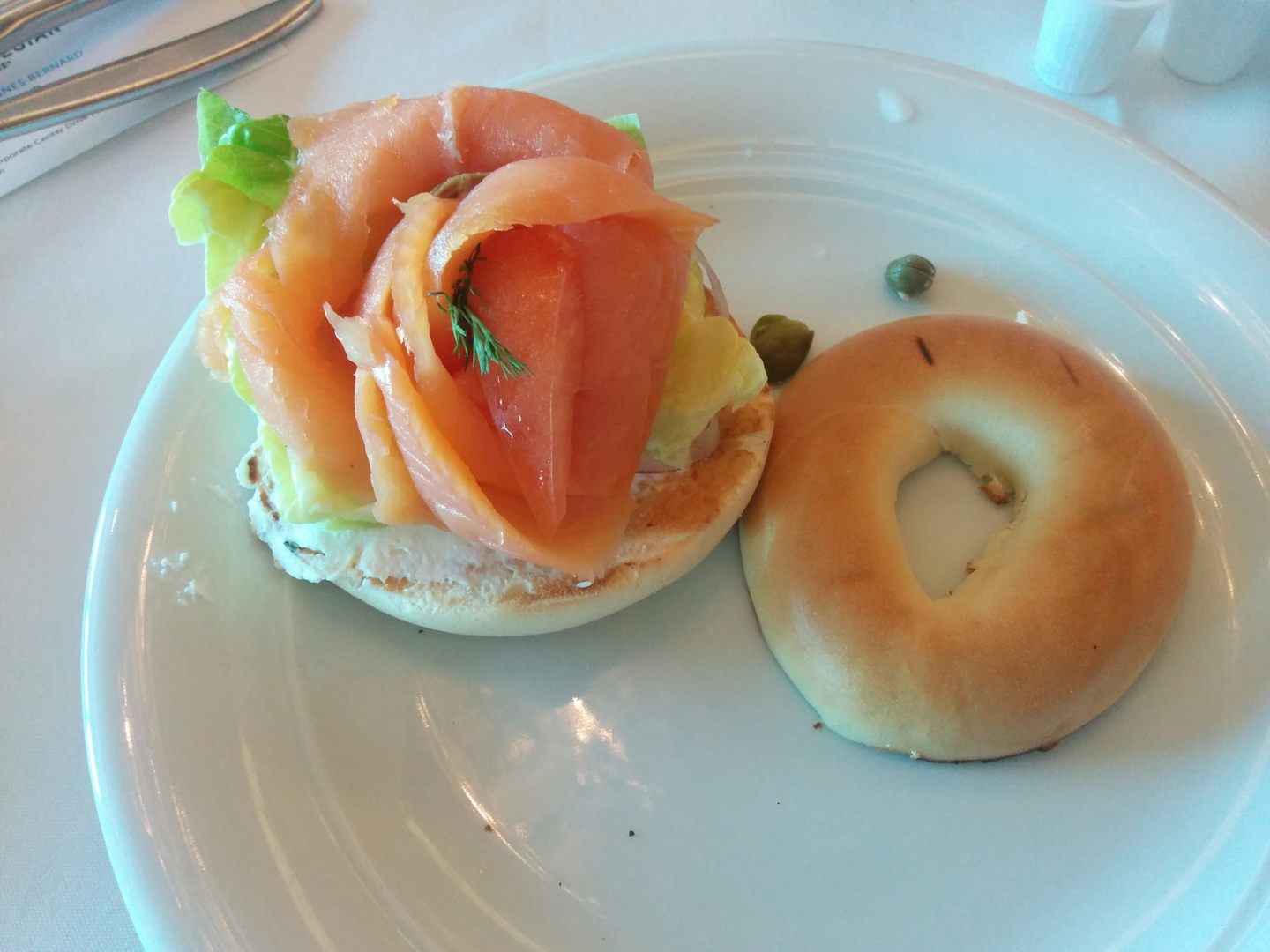 Smoked salmon and cream cheese on a toasted bagel, one of the daily breakfast entrees. Very tasty and fresh!
