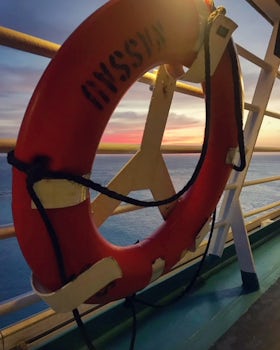 Sunset onboard the Adventure of the Seas, through the life saver.