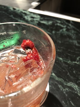 Served drink made with moldy raspberries at dinner