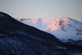 Sunrise on the mountains arriving at Tromso
