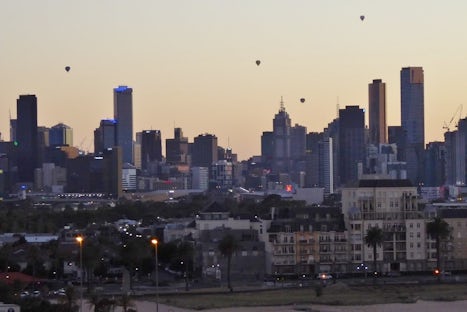 View of balloons rising over Melbourne Port