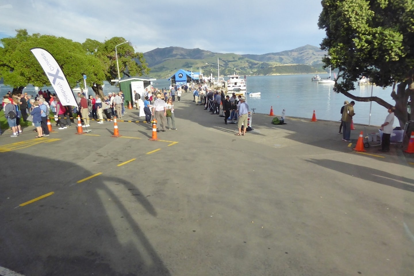 Akaroa jetty with queue waiting to board tender boat
