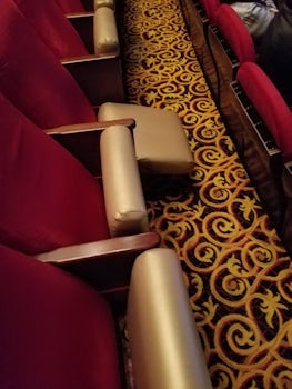 In the theater there were broken chairs in every row we sat in.