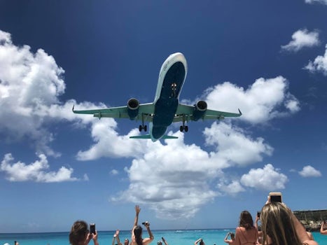 Moho Beach.... watch airplanes land as you sit on the beach.