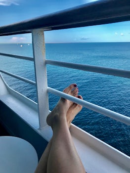 Relaxing on our stateroom balcony.