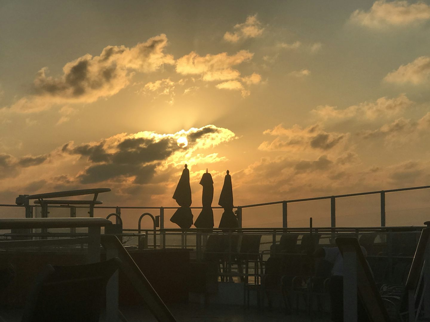This was on the top deck of the ship at sunset.