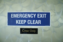 Emergency exit kept locked and now labelled for crew only. What about the p