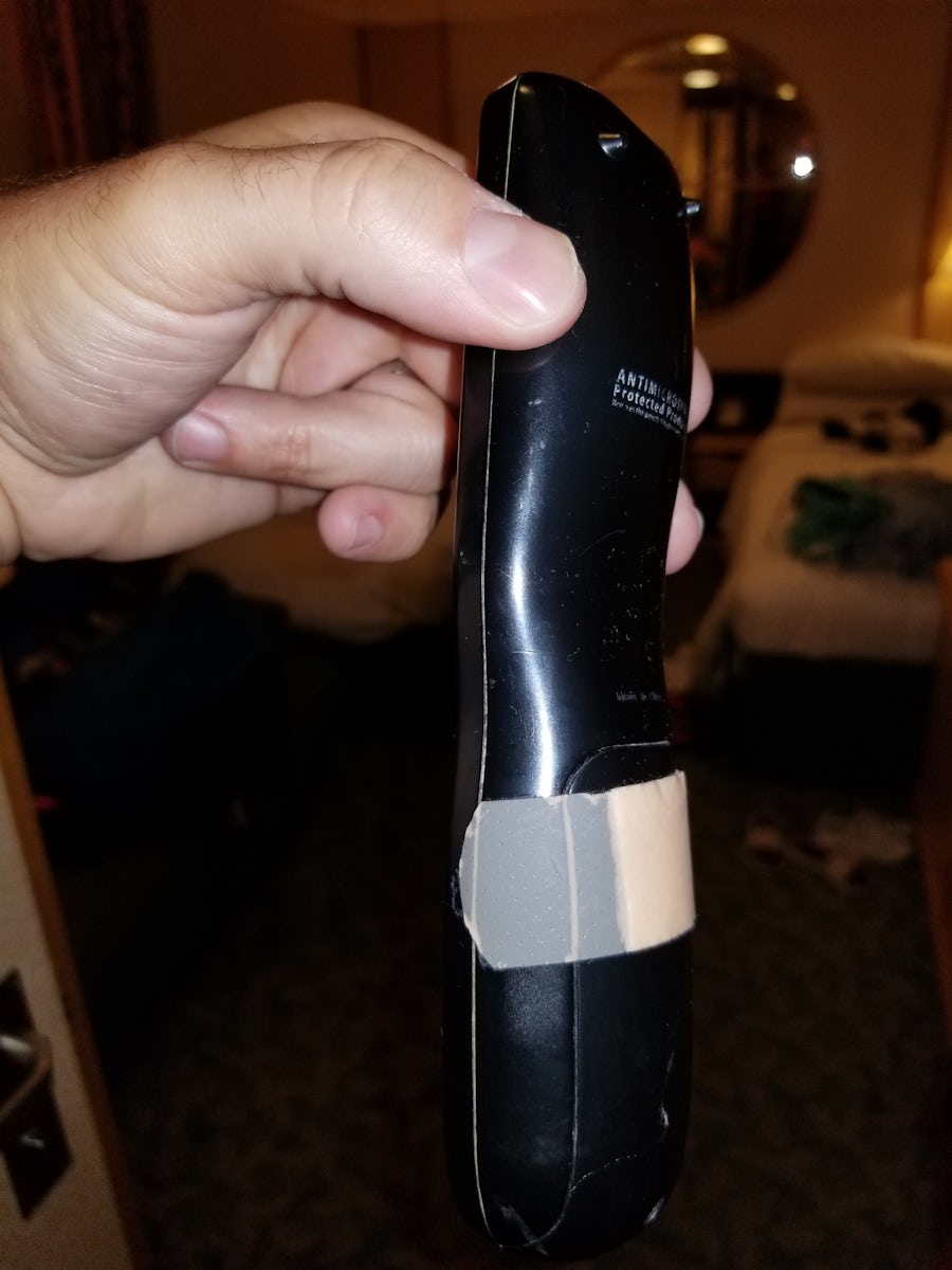 Band aid used to keep remote together. We only hope that it was a clean new