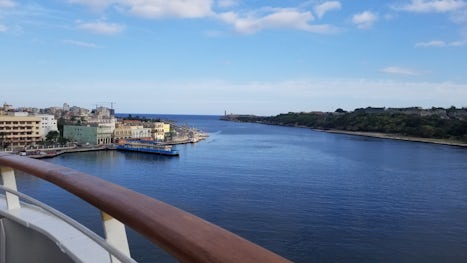 The ship arriving at the pier. The castle on the right and Old Havana on th