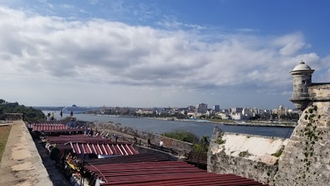 A picture of Old Havana with the NCL Sky in the background.
