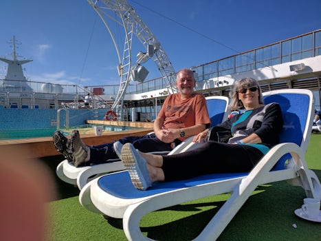 Relaxing in the sunshine on the deck on our way across the Atlantic ocean.