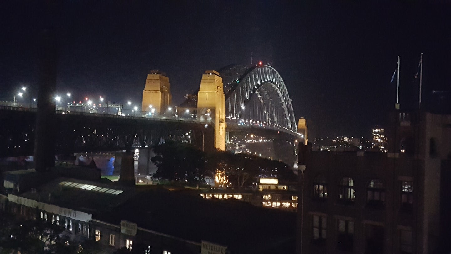 Sydney Harbor bridge view at night from pool deck at Holiday Inn Old Sydney