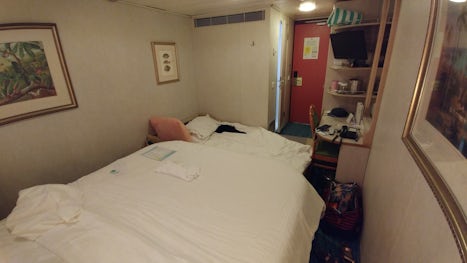You can see there is ZERO floor space across the "extra" bed.