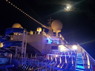 Conquest forward from lido deck at night