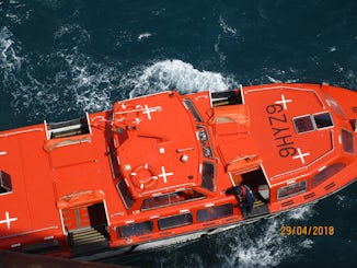 Horizon tender pulling away from ship to port