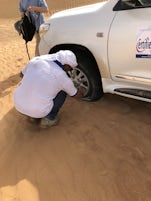 Dubai dune bashing flat tire. Had to wait outside vehicle in 100+ temps.