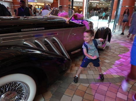 Grandson loved the neat car on display on ship.