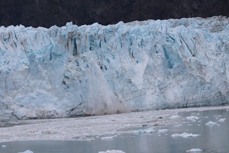 Photo of ice falling off a glacier taken from our balcony