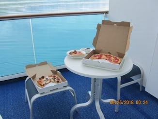 Room service pizza on the balcony during viewing of Glacier Bay.