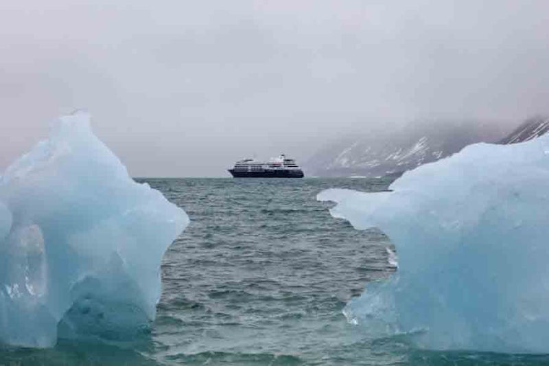 Silver Cloud between two icebergs.