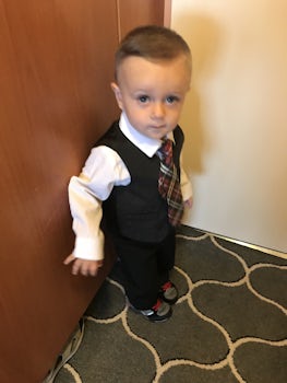 Grandson dressing up for formal dinner